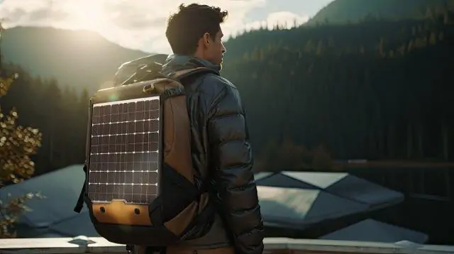 A man wearing a backpack with a solar panel on it. Solar Power Kits for RV. RV Lifestyle Experts