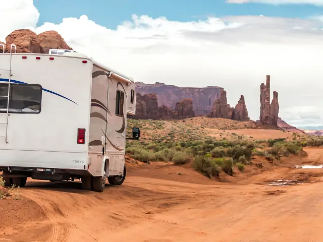 An RV parked on a dirt road at an RV show in California. RV Lifestyle Experts