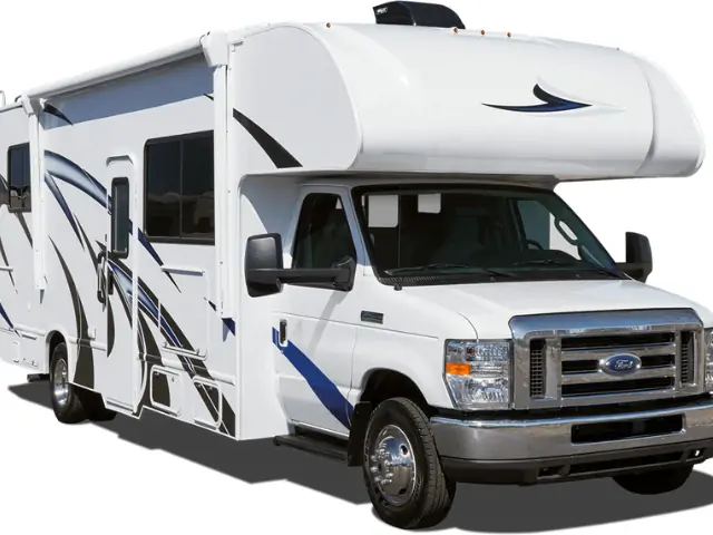 A white RV with black stripes, showcased at RV shows in California. RV Lifestyle Experts