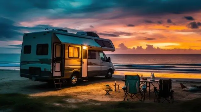 An rv parked on the beach at sunset. Keeping RV Cool in Extreme Heat. RV Lifestyle Experts