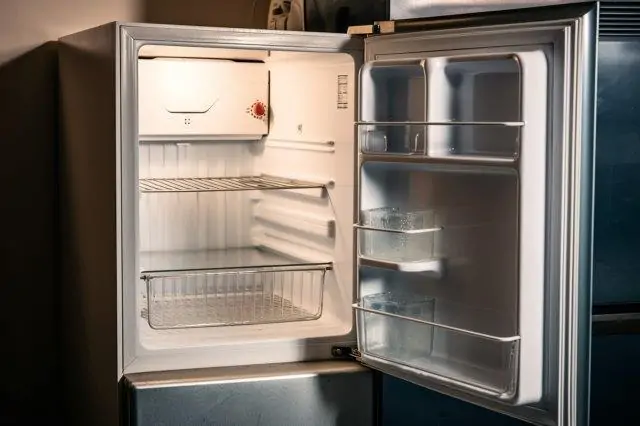 An open refrigerator in a dark room. RV Lifestyle Experts